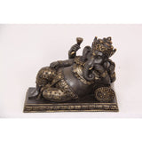 Load image into Gallery viewer, Resting Ganesh on Cushion in Gold Colour - 15cm
